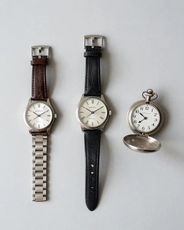 Three vintage wristwatches and a silver pocket watch found while thrifting