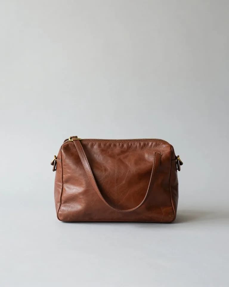 Brown vintage Coach leather shoulder bag with brass hardware